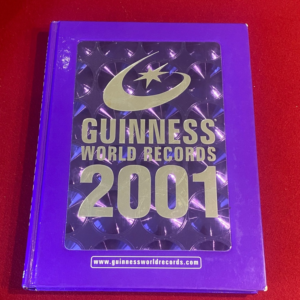 Guinness Hardcover Book in Purple with Gold Accents
